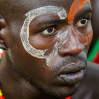 The Painted Face of a Hamar man at the Bull Jumping Ceremony, Ethiopia