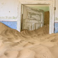 A Sand Dune Flowing like Water out of a Room, Kolmanskop Ghost Town, Namibia