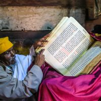 A Drunken Monk Taking us through his Bible, Debre Damo, Ethiopia