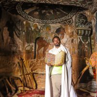 The Priest of Abuna Yemata Showing us a Goatskinned Bible in Written in Geez, Abuna Yemata, Ethiopia